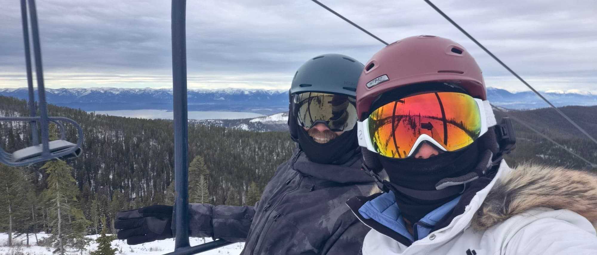 A chairlift ride above Flathead Lake, with the water and mountain ridges beyond.